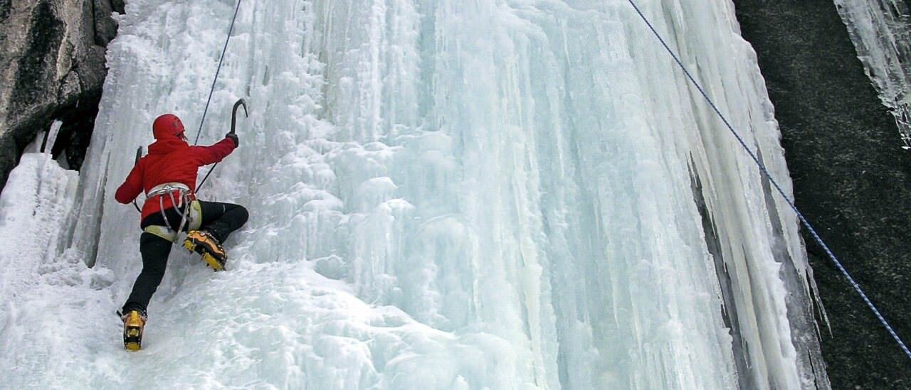 Laura Hattan ice climbing Blue Room on Fremont Lake near Pinedale, Wyoming