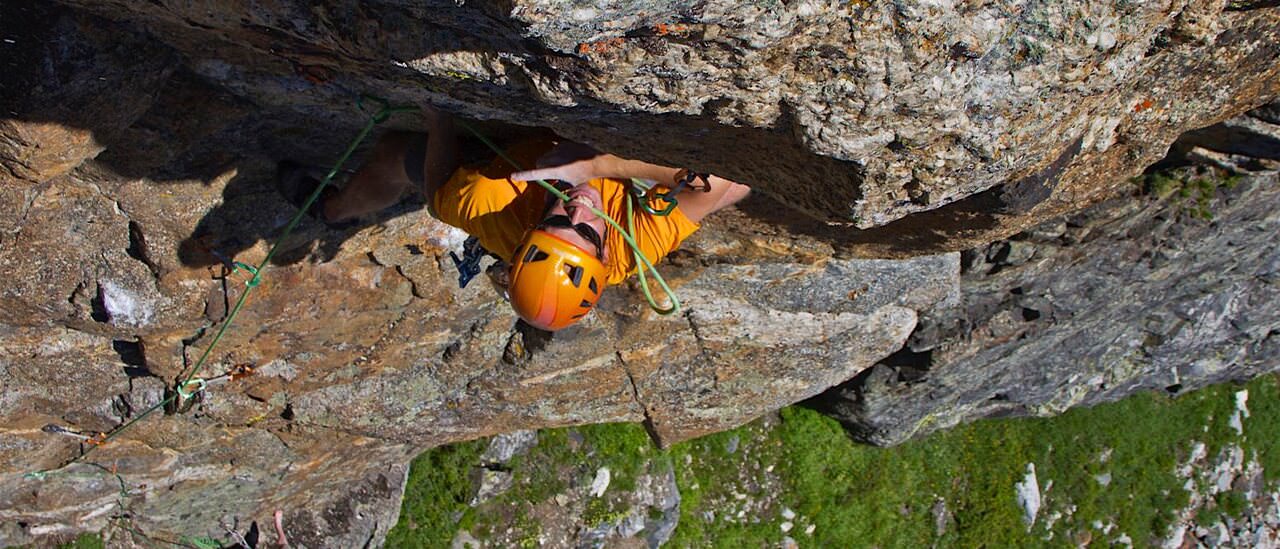Climber under a roof on Knockin’ on the Sky at Rock Springs Buttress, Jackson Hole