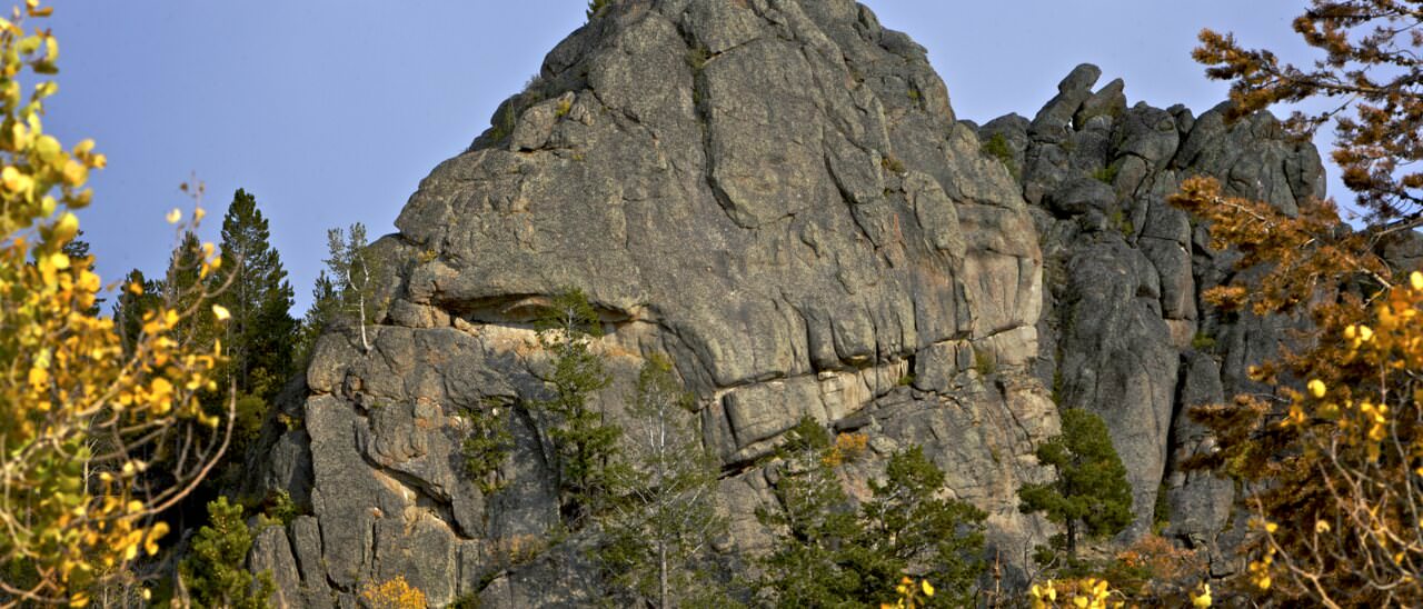 South Buttress at Lizard Rocks near Pinedale, Wyoming — granite crag framed by autumn aspens