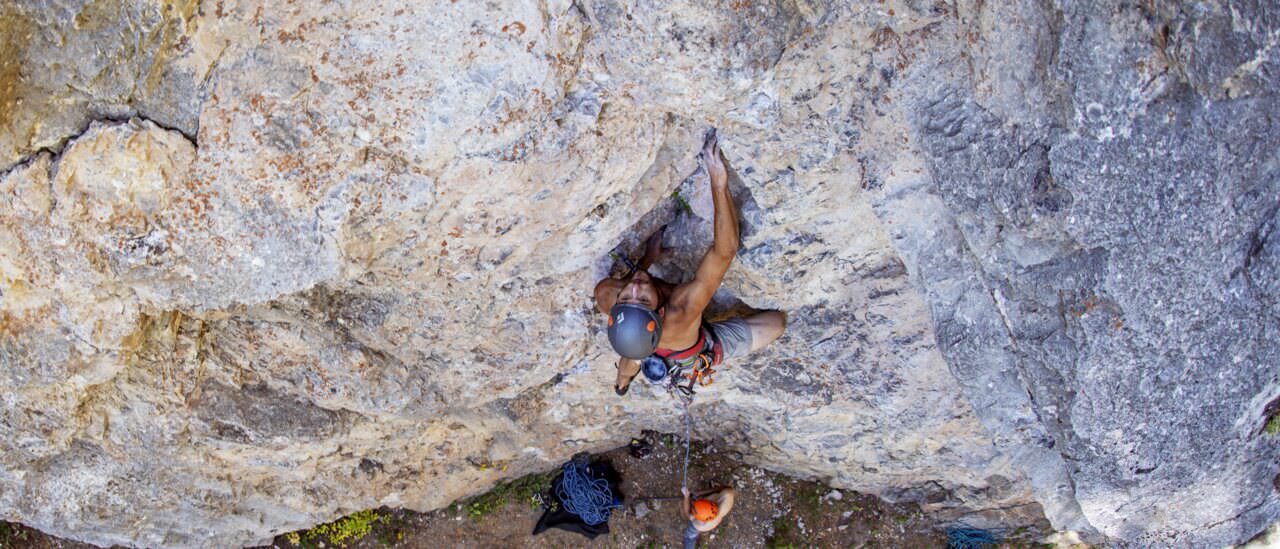 Sport climber on limestone at Wilson Canyon near Jackson, Wyoming