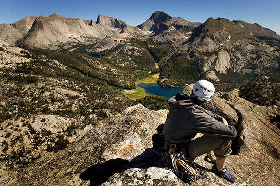 Wesley Gooch enjoying the views from the summit of Sundance Pinnacle near the Cirque of the Towers. Photo by Jed Conklin.